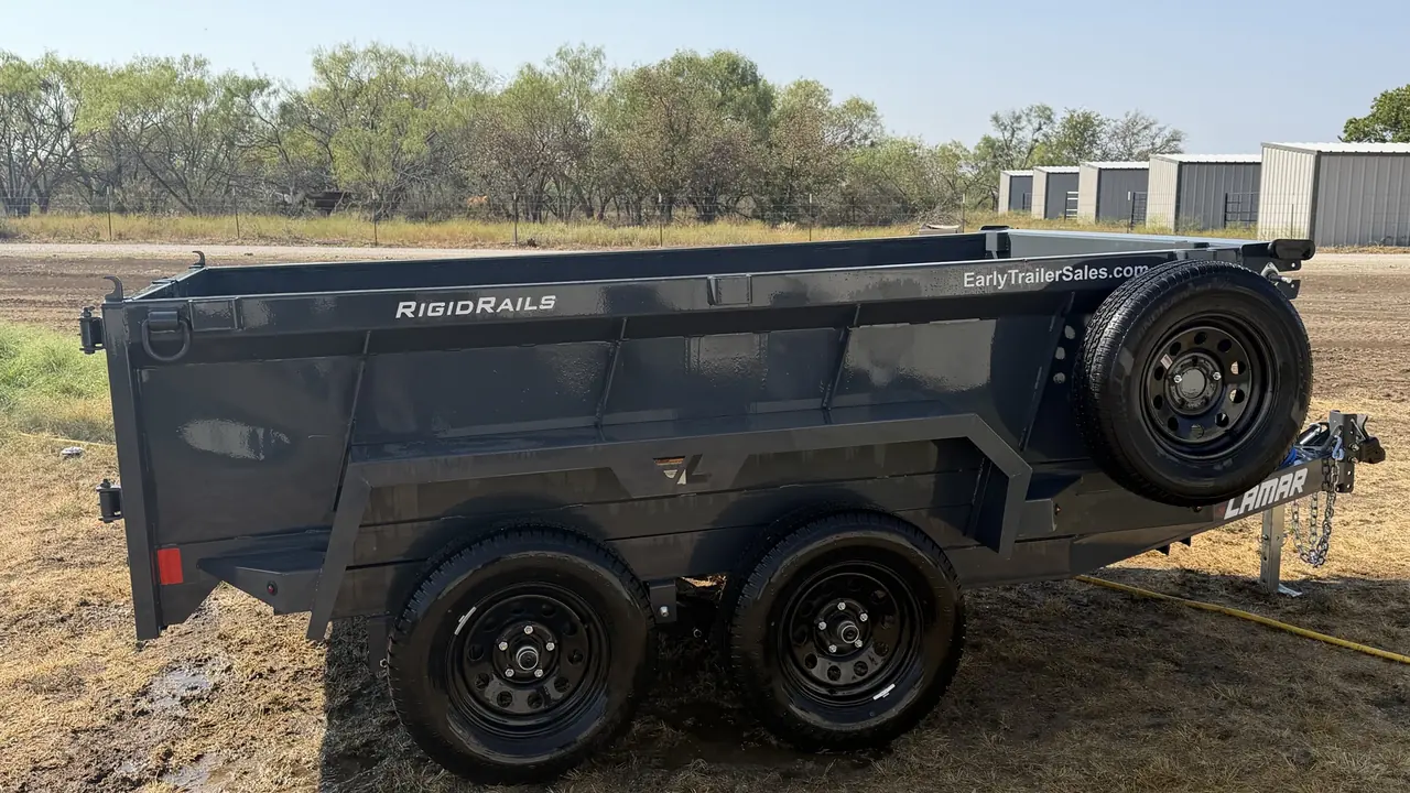 APEX 10' × 24&Prime; Dump trailer — side profile on the yard.